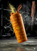 BEASTOX Performance Shaker in orange with motivational text, mid-air splash shot, showcasing leak-proof design and athletic aesthetics.